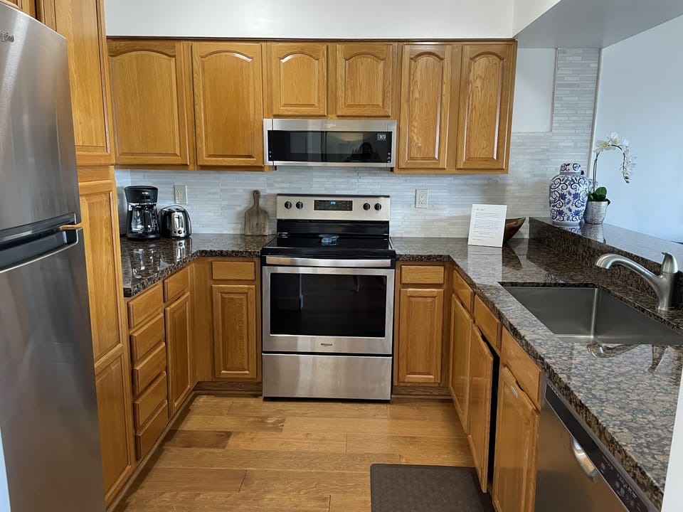 stainless steel appliances in a full kitchen