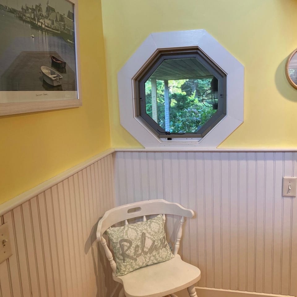 A porthole window to the back porch is one of many nice touches