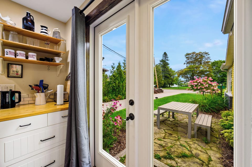French door off the kitchen to the outdoor seating area.