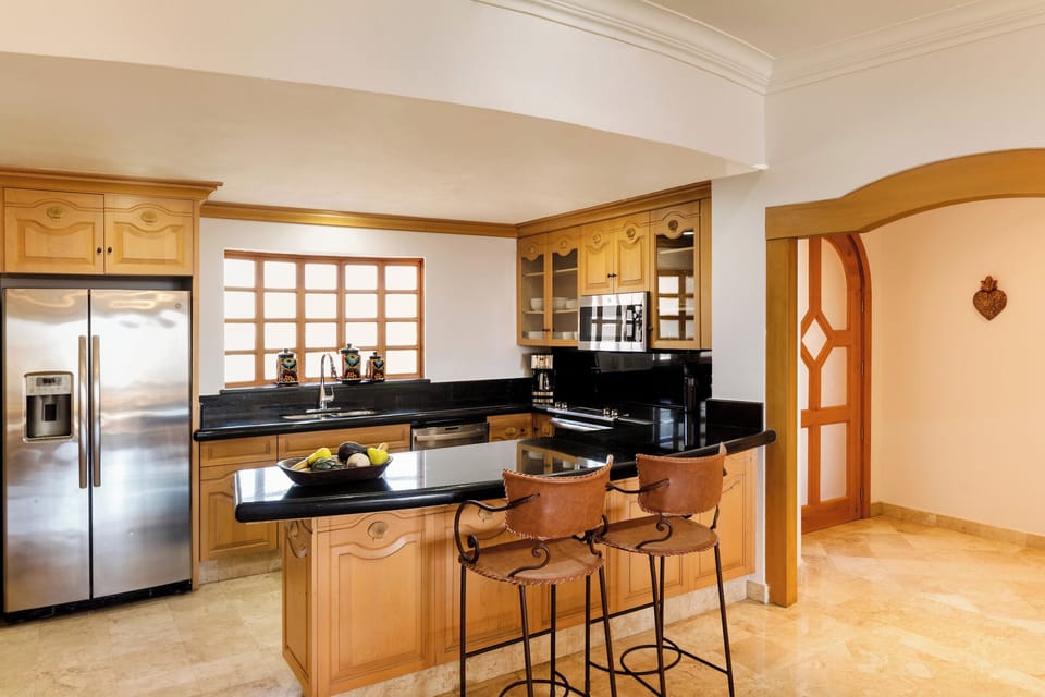 Updated full kitchen with laundry facilities, granite and stainless appliances