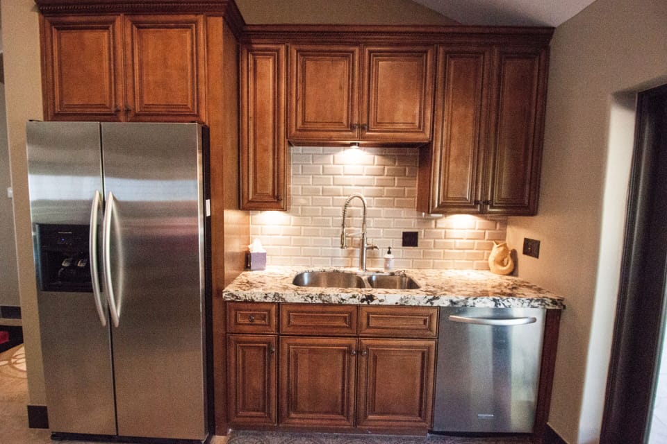 Kitchen: Gorgeous cabinets and new subway tile.