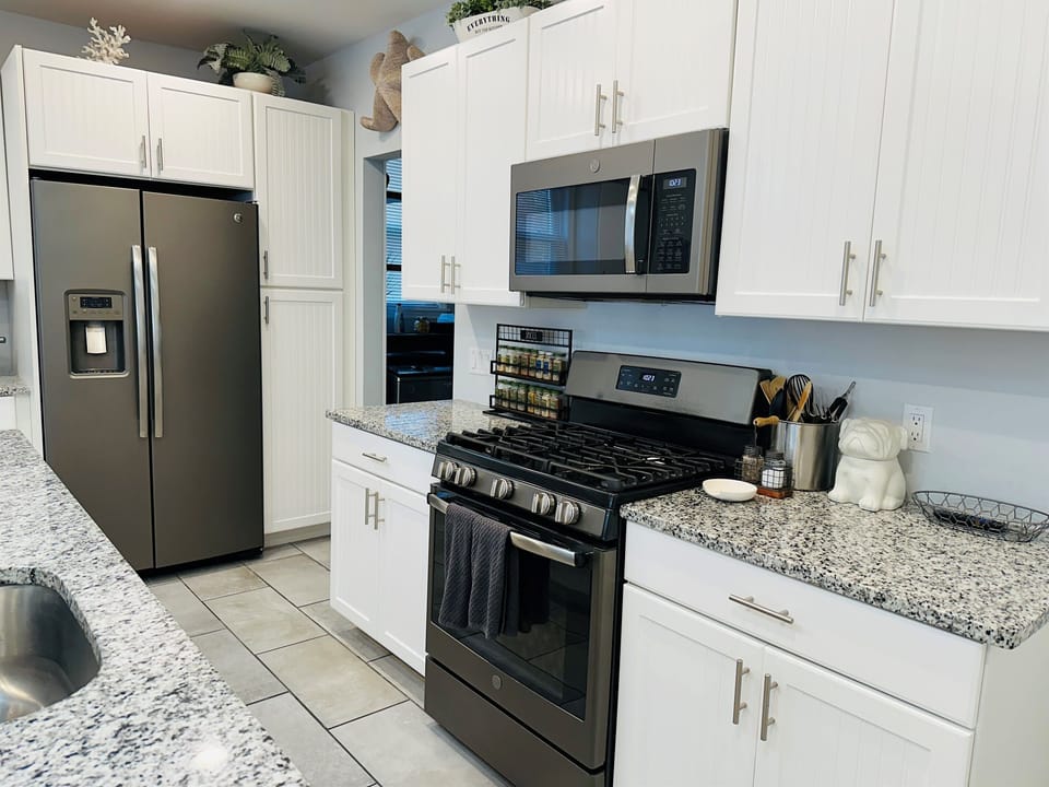 Kitchen | Fully Stocked | Open Concept | Granite Countertops | Stainless Steel Appliances | Wine Fridge | Island | Seating for 4 at Island | Roku TV