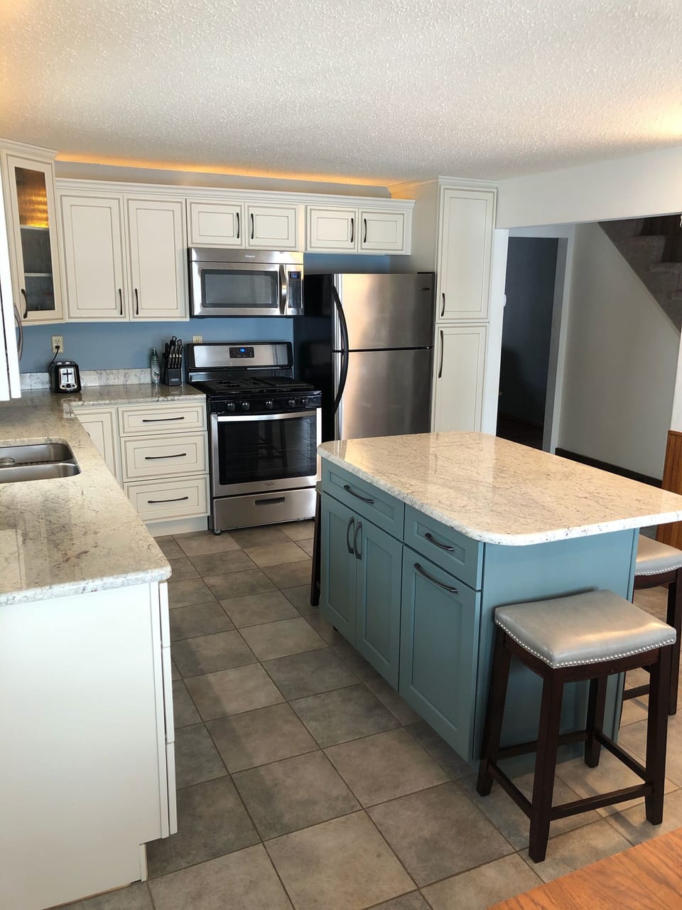 Kitchen w/ dining table and lake view 