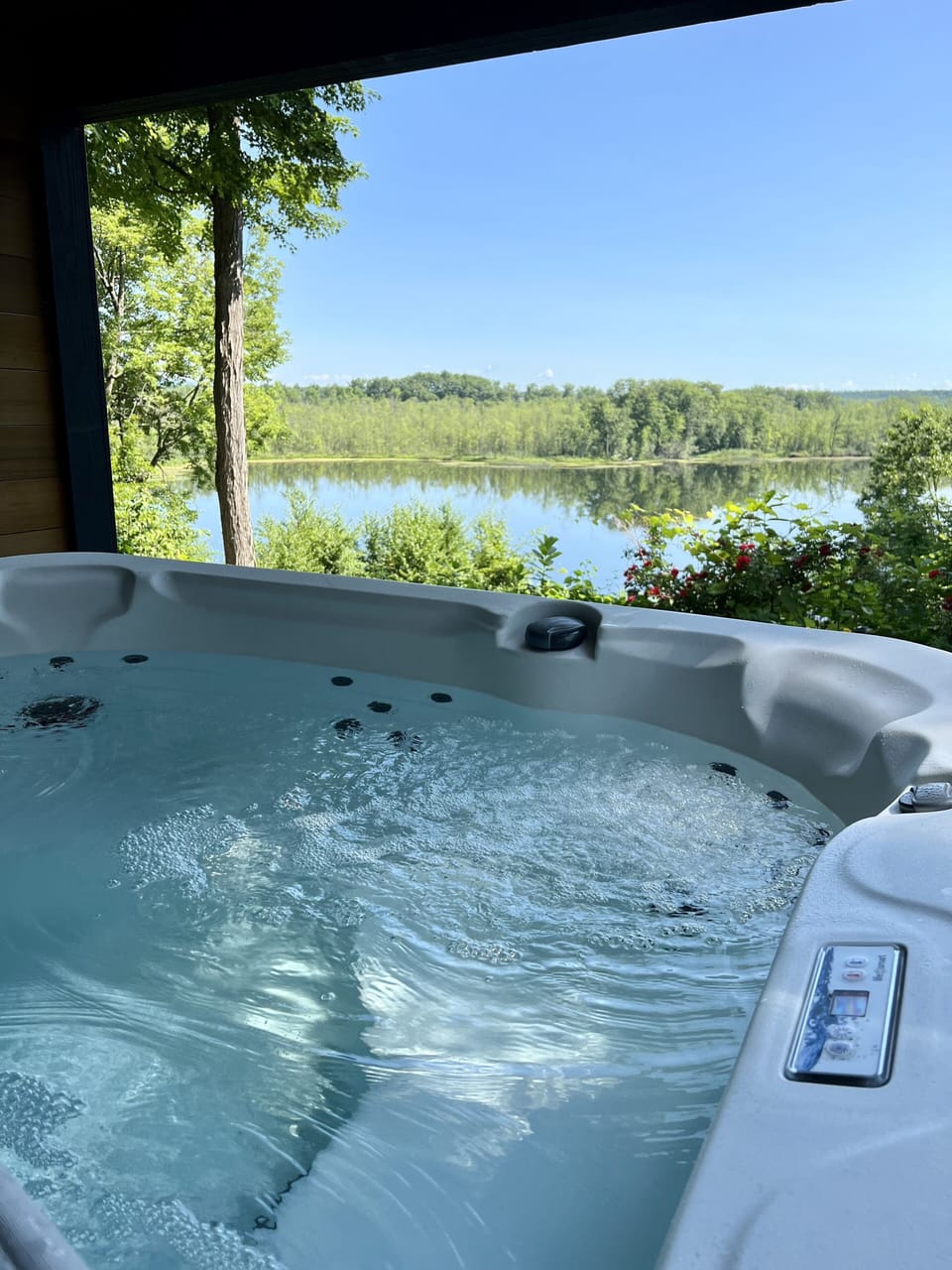 Hot tub overlooking the lake- with outdoor shower