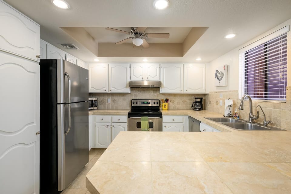 Stainless steel appliances in this updated kitchen.