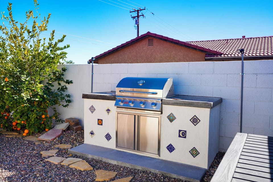 Around the corner, the gas barbecue gives you plenty of space for grilling up a meal.