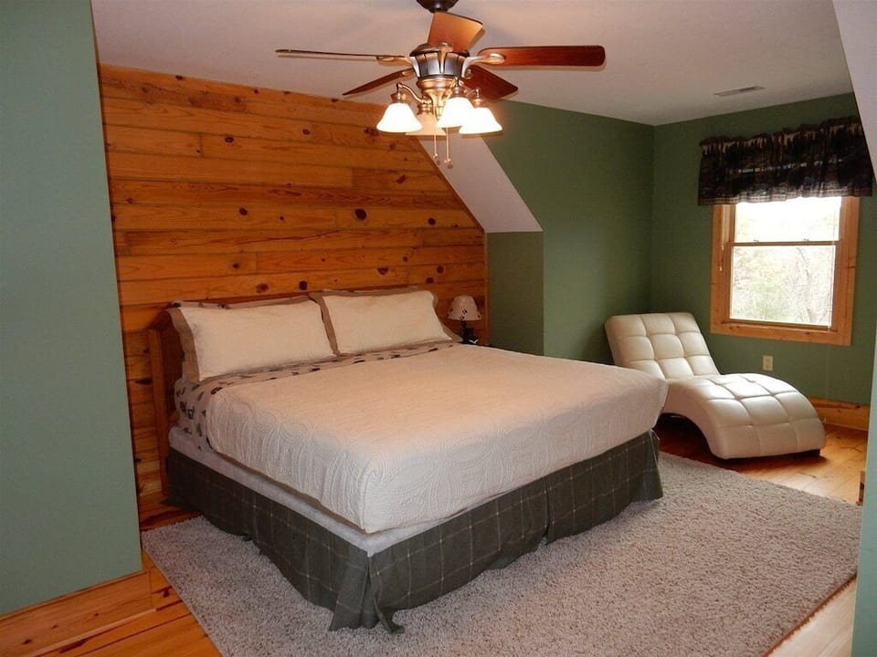 Upstairs bedroom features a king sized bed