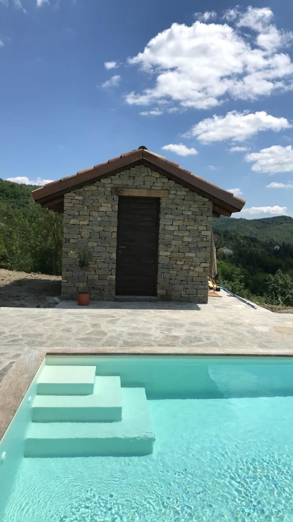 Pool house with toilet and outdoor shower