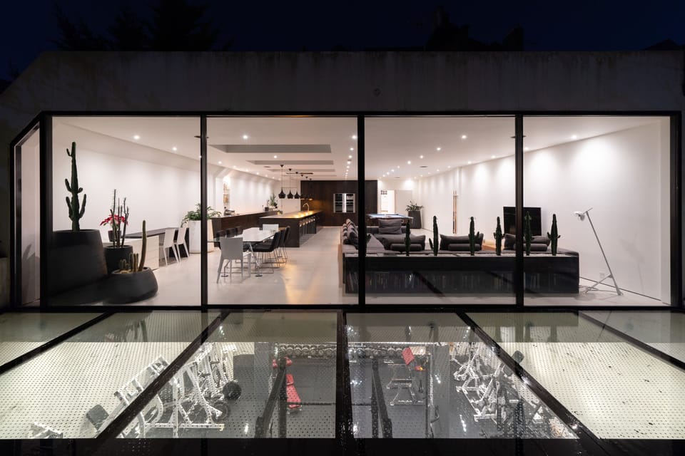Exterior view of kitchen and gym at night