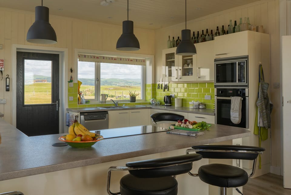 The kitchen has superb views over the Cambrian Mountains (E) and the dunes (W)