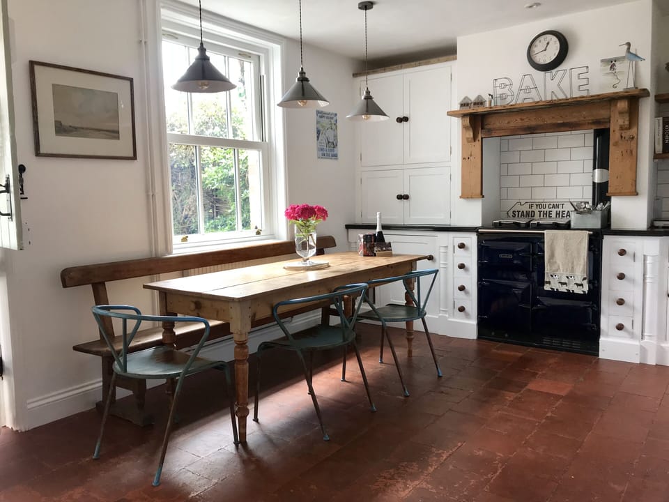 Front facing kitchen; farmhouse table, Rayburn & ample crockery for 6/8