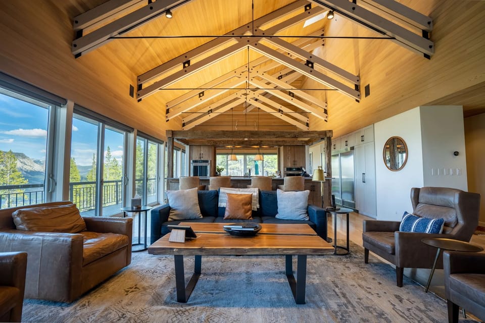Living room with 25ft ceilings and custom beam work and skylights.