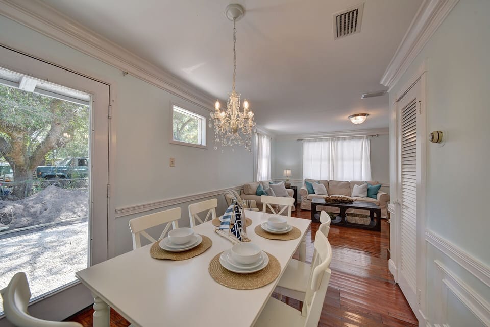 Living room is open to the dining room which seats 6.