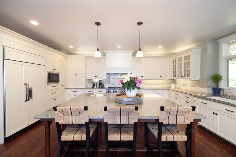 Chef's kitchen with large island and plenty of prep space. 