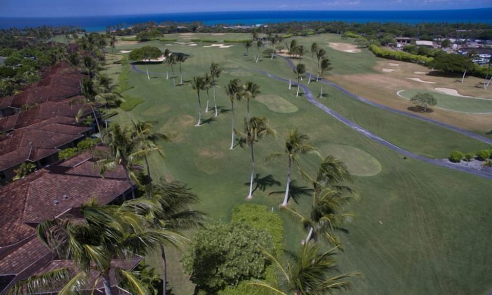 Aerial shot of the pristine golf course, perfect for golf enthusiasts seeking a challenge.