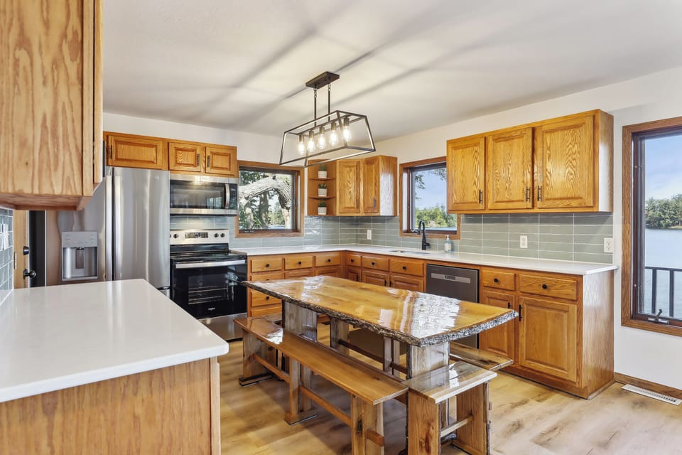 Fully equipped kitchen with custom live-edge dining table.