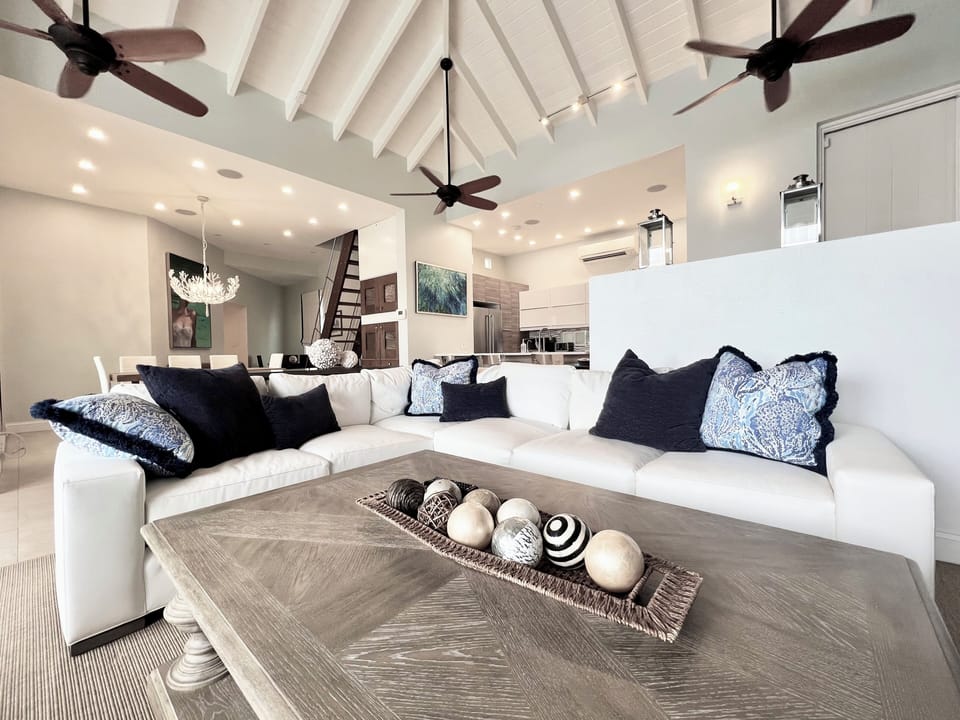 Spacious, bright living room, breathtaking oceanfront views with cozy seating.