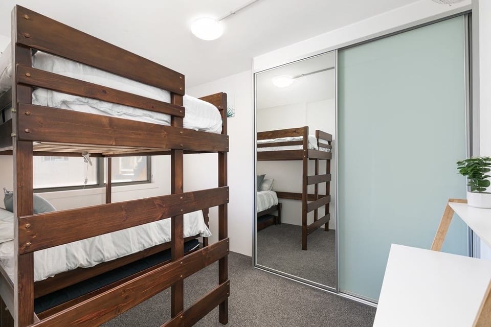 Bedroom with single bed, king single loft bed, single trundle and desk