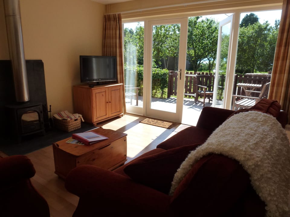 French doors leading to shared patio overlooking the orchard and farmland