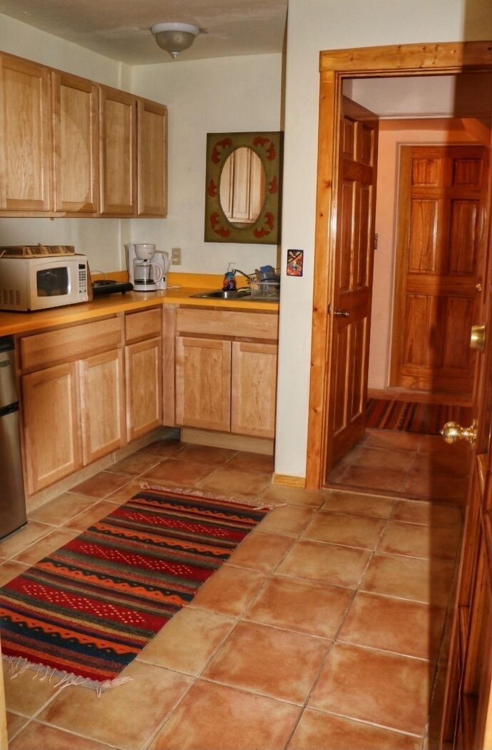 downstairs kitchenette w/microwave, toaster oven, hotplate, water heater, coffee