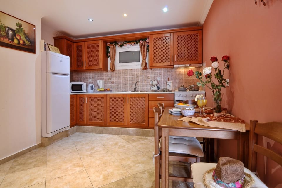 Angela Pool Apartment Agios Georgios Kitchen And Dining Area