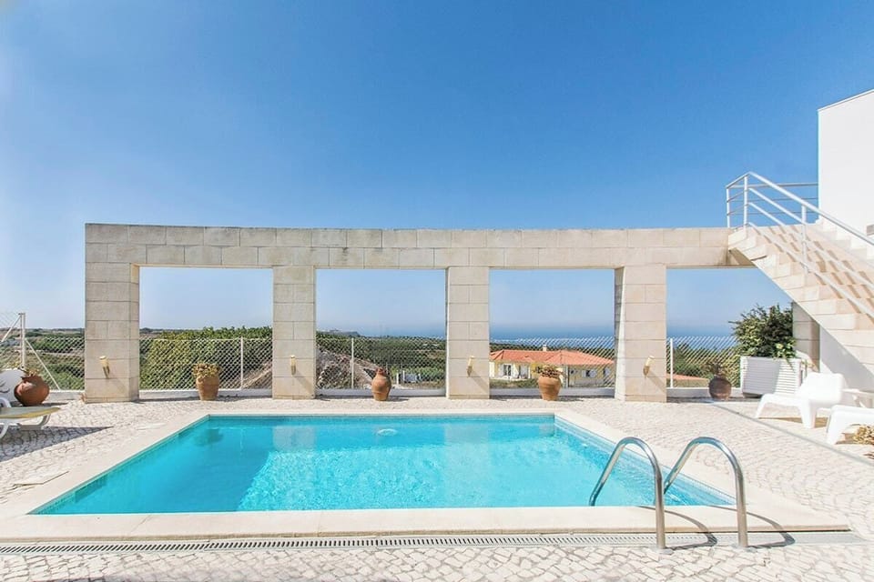 Private pool and stone terrace with panoramic windows — Villa Foz, luxury holiday villa in Sesimbra