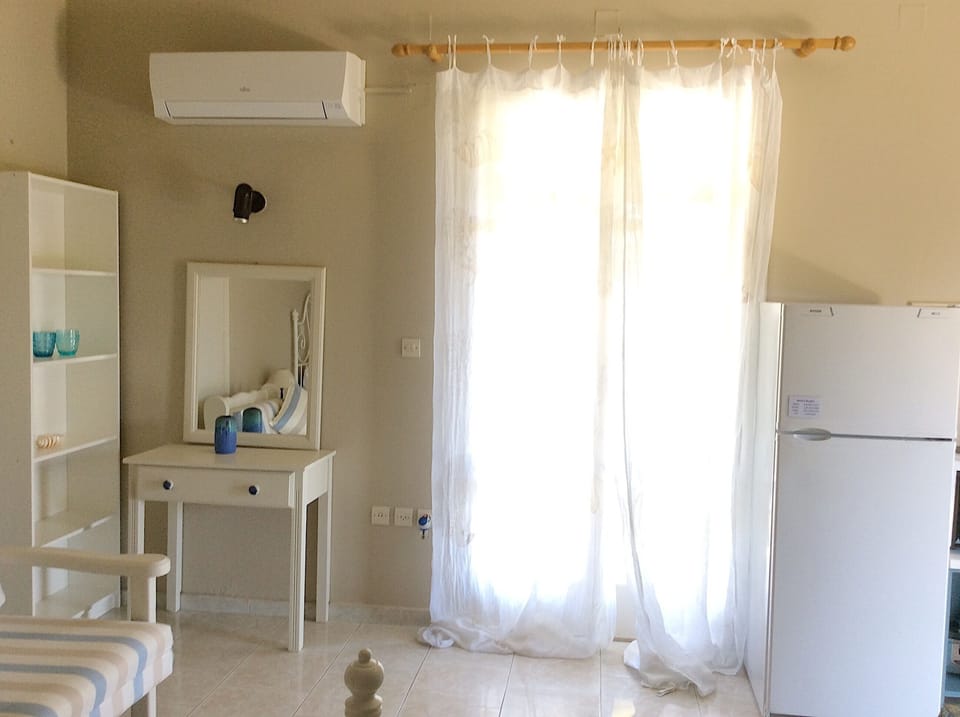A studio is designed in gentle, light colors. Spartia Kefalonia studios, Greece