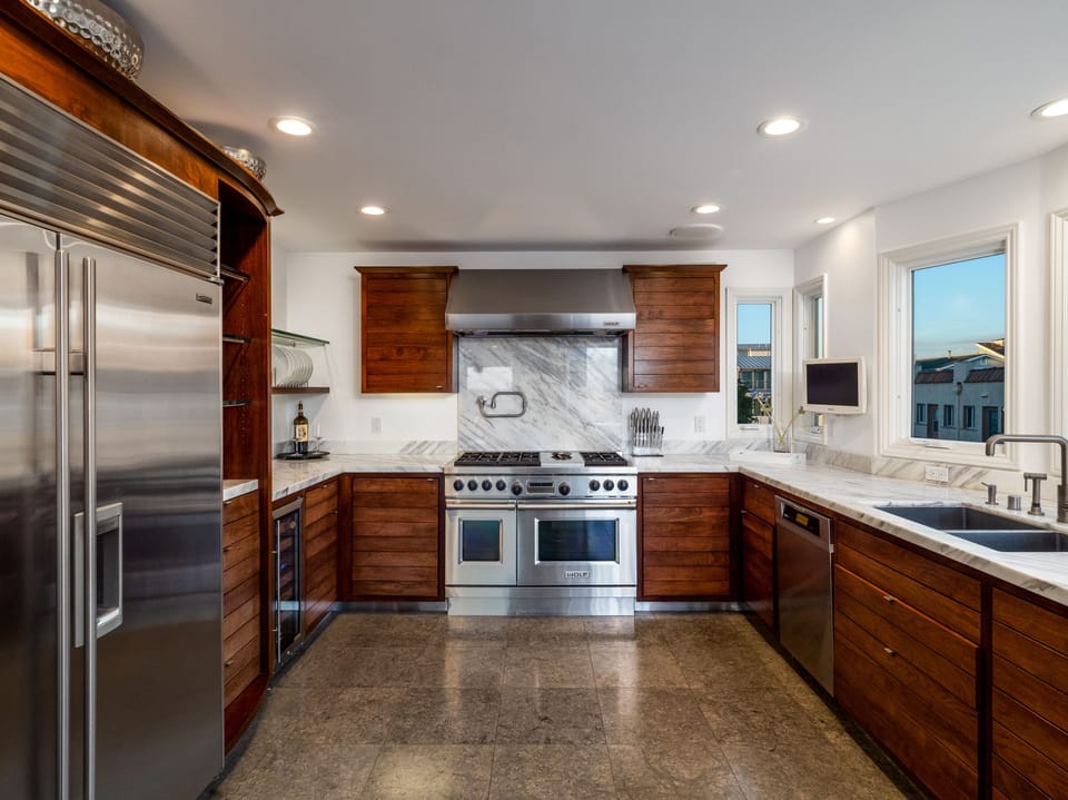 Beautiful Walnut kitchen stocked with everything you would need to cook/enjoy. 