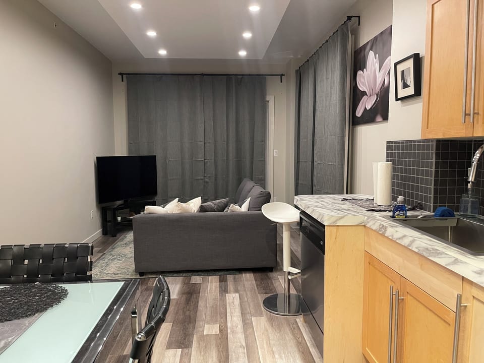 Open kitchen/living rm with adjustable lights and black out drapes for privacy.