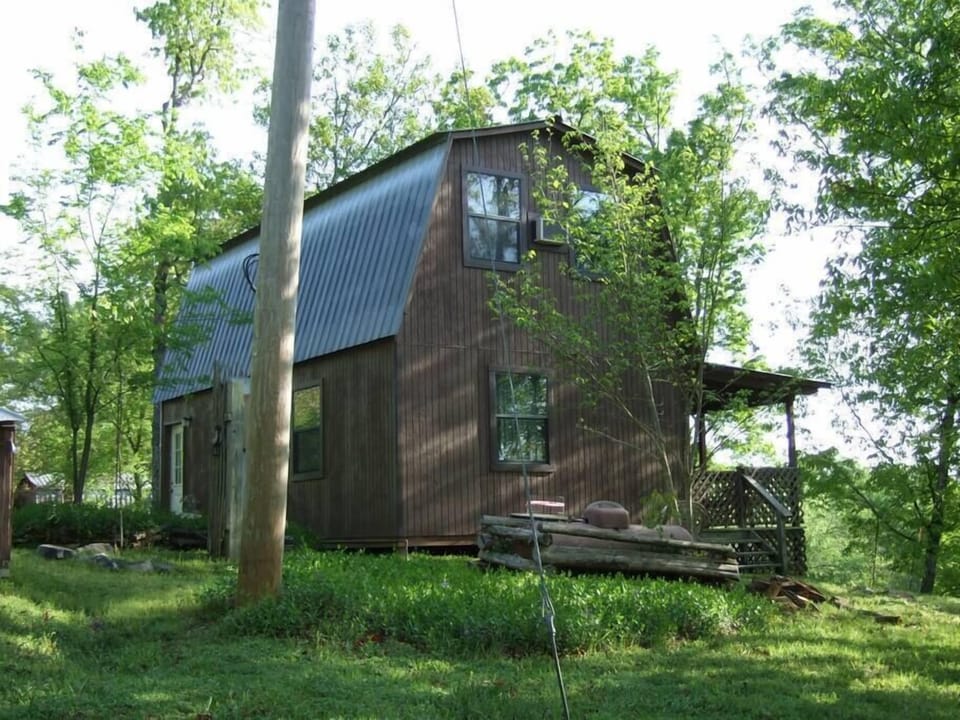 Enchanted cabin in forest on bluff near Ouachita River