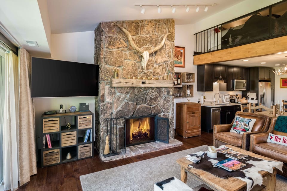 Living area with 72" flat screen TV