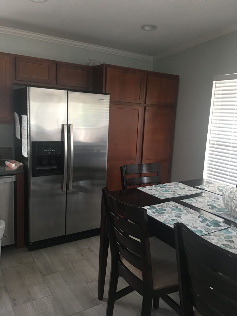 Stainless steel kitchen appliances throughout. 