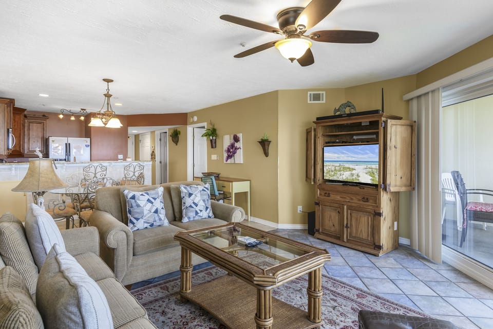 A smart TV and easy seating with Gulf views beyond.