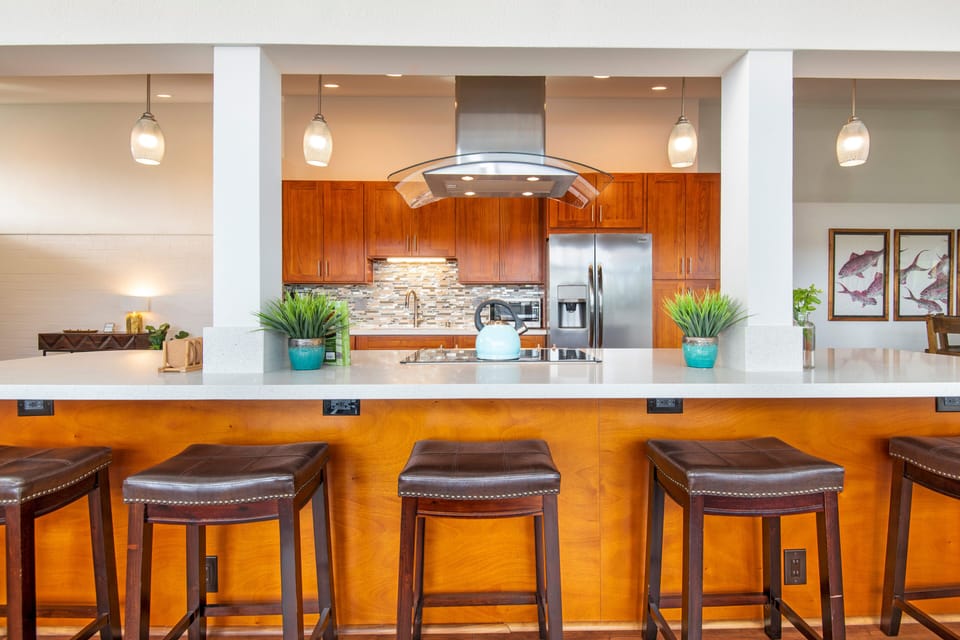 Cook up a delicious meal in the fully equipped kitchen, complete with modern appliances and a breakfast bar.