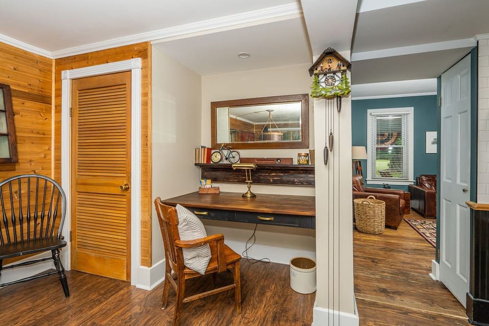 Laundry room to the left of the desk with view into the living room. 