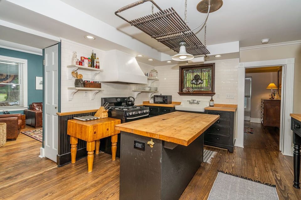 Electric stove, microwave, toaster, Kitchen Aid mixer and crock pot.  