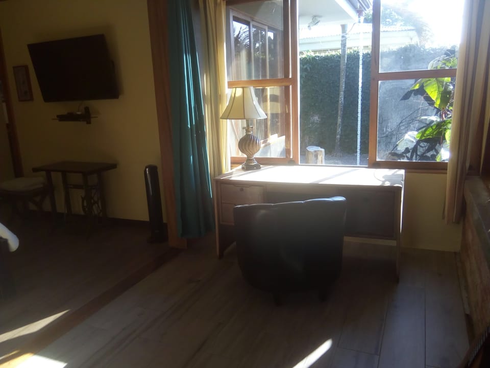 Master Bedroom has desk and chair in the sunroom for private workspace