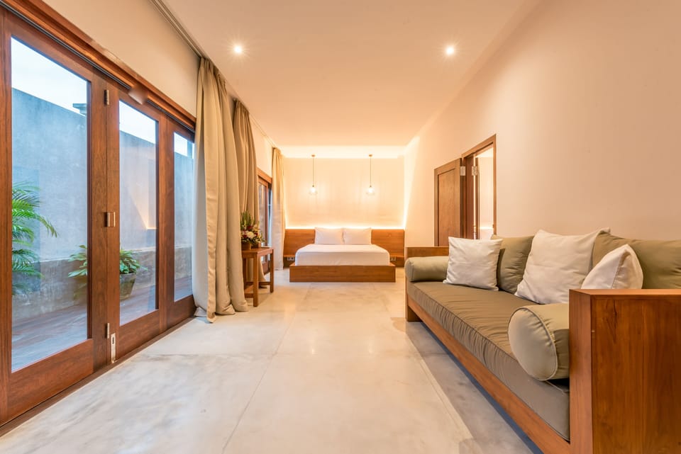 Large adjoining rooms with sofa that can be converted to a single bed
