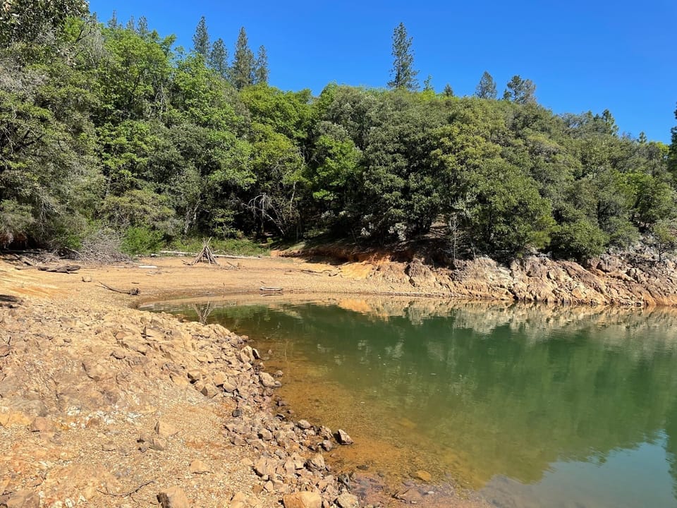 The cove.  Five minute walk through public land.  Great for swimming and picnics