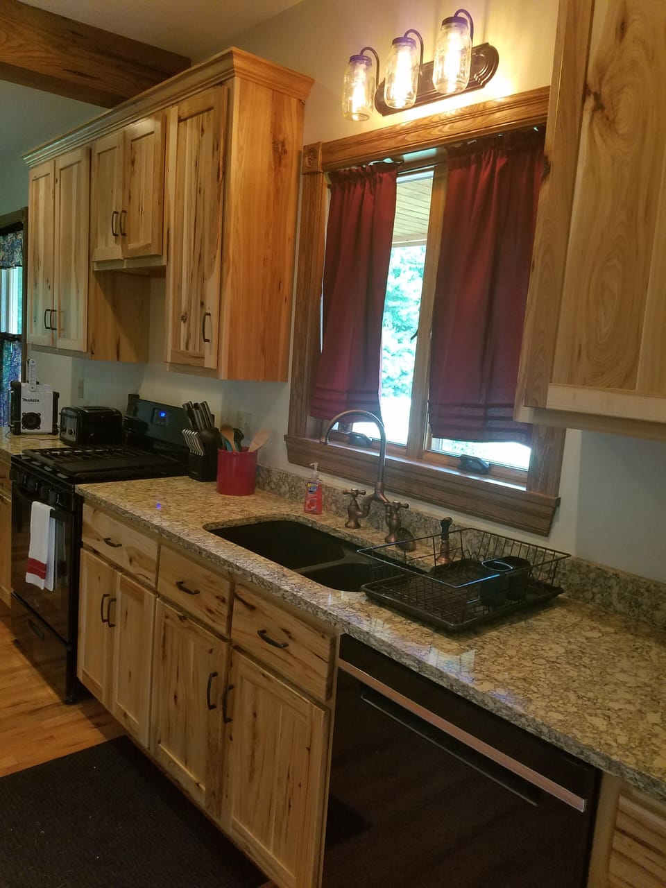 Custom made Hickory Cabinets. Granite countertops. 