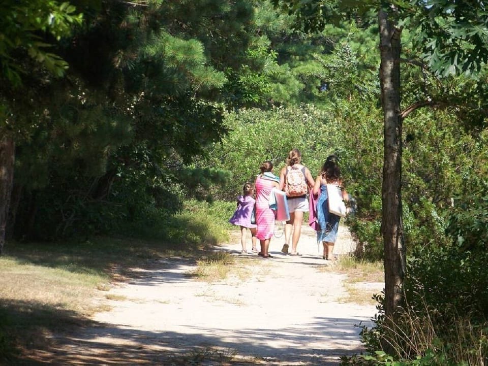 Stroll down the sandy path on the other side of the road to the beach.