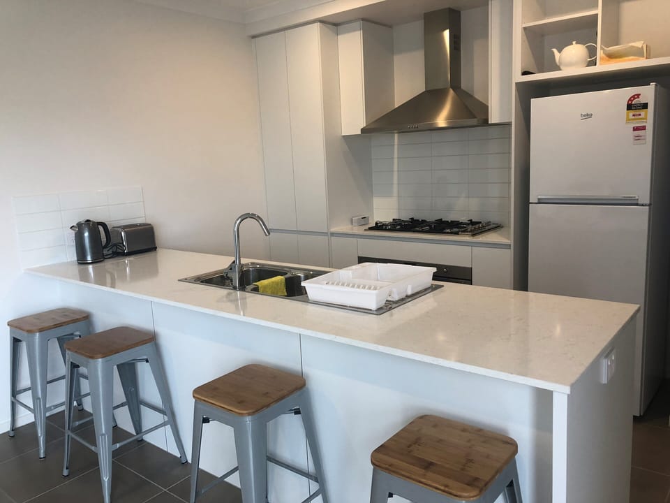 Ultra modern kitchen including all cooking  appliances and utensils
