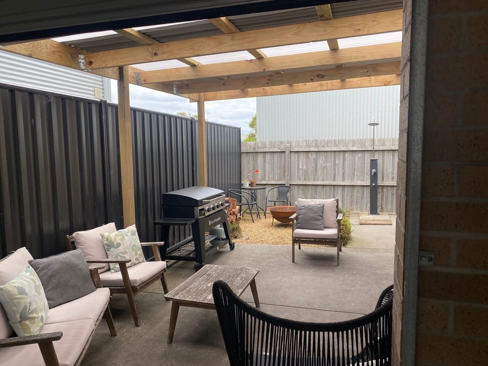 Great outdoor under cover area, with comfy outdoor setting and brand new BBQ