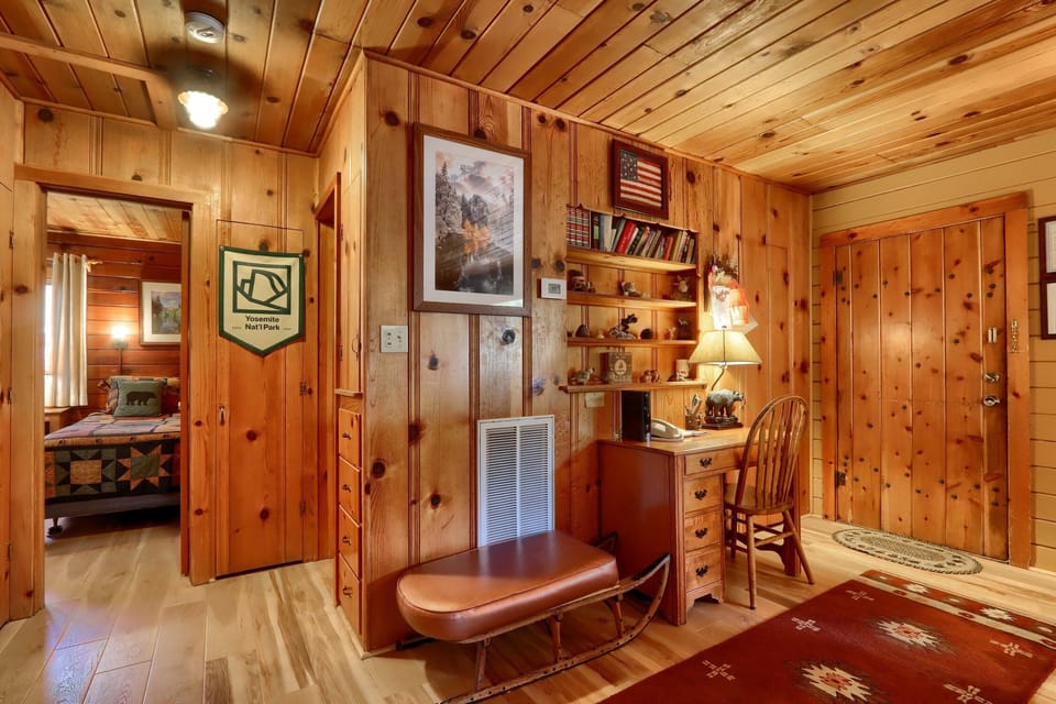Entryway with all-new hardwood floors throughout the cabin