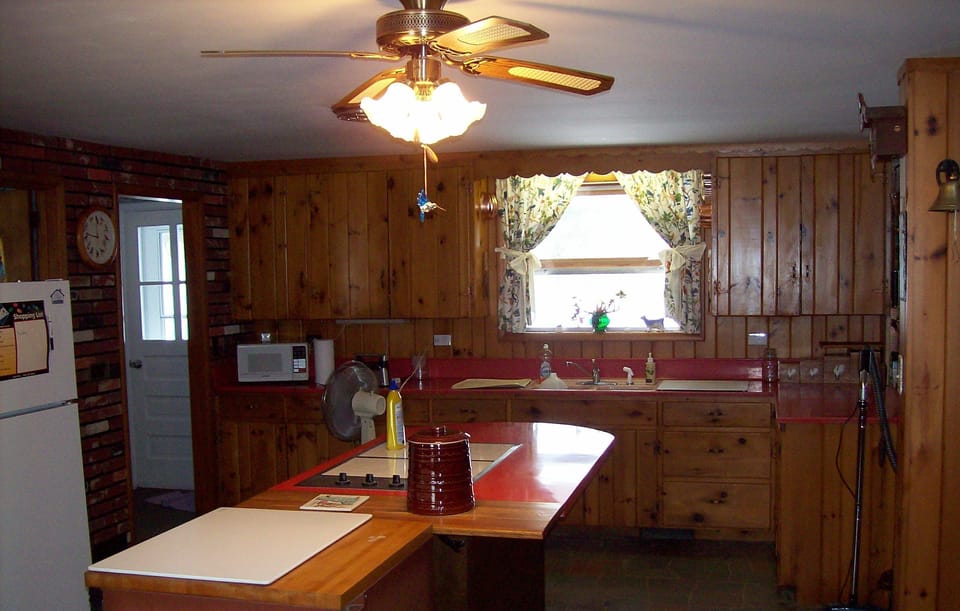 kitchen island and sink area below window