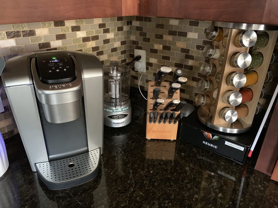 Coffee station with a variety of K-cups, and well equipped spice rack.    Everyt