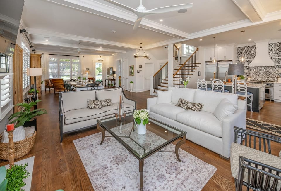 Living room has 2 large sofas and an armed chair for plenty of seating.