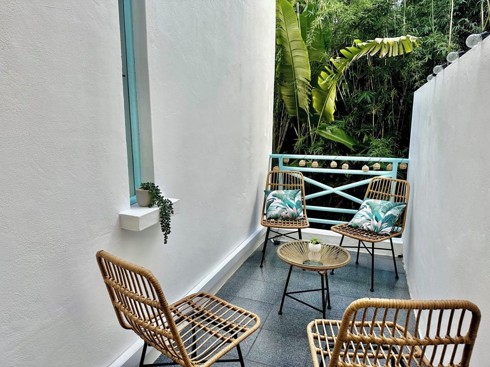 Balcony accessible from the living/dining room, overlooking vegetation