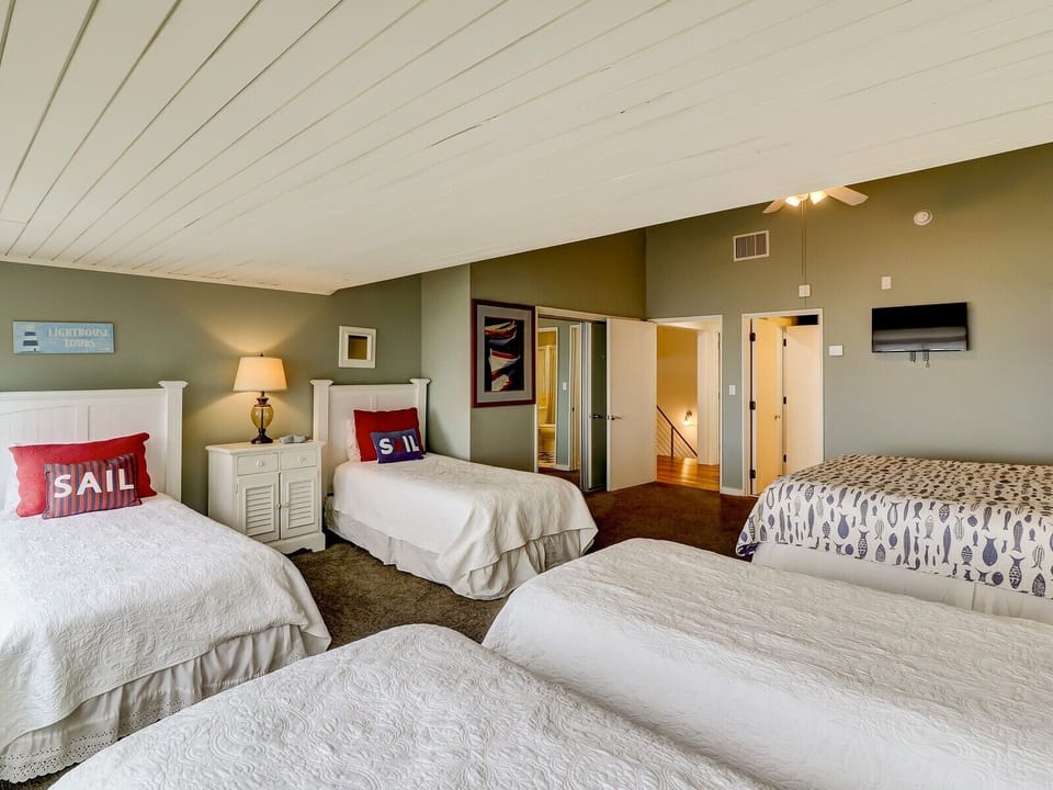 Upstairs Bedroom Perfect for Kids Offers One King Bed and Four Twin Beds with One Private Bath and Access to a Hall Bath at 8 Ketch