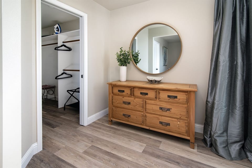 Make yourself at home with this luxurious walk-in closet and dresser in the second bedroom.